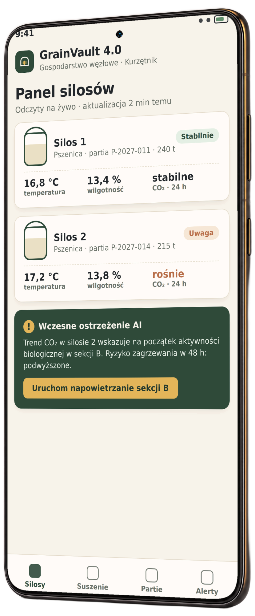 Makieta aplikacji GrainVault na telefonie: panel silosów z odczytami temperatury, wilgotności i CO2 oraz ostrzeżeniem AI